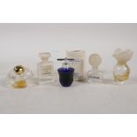 Five vintage miniature glass eau de parfum bottles, including Chanel No 5, YSL Baby Doll, Chloe etc,