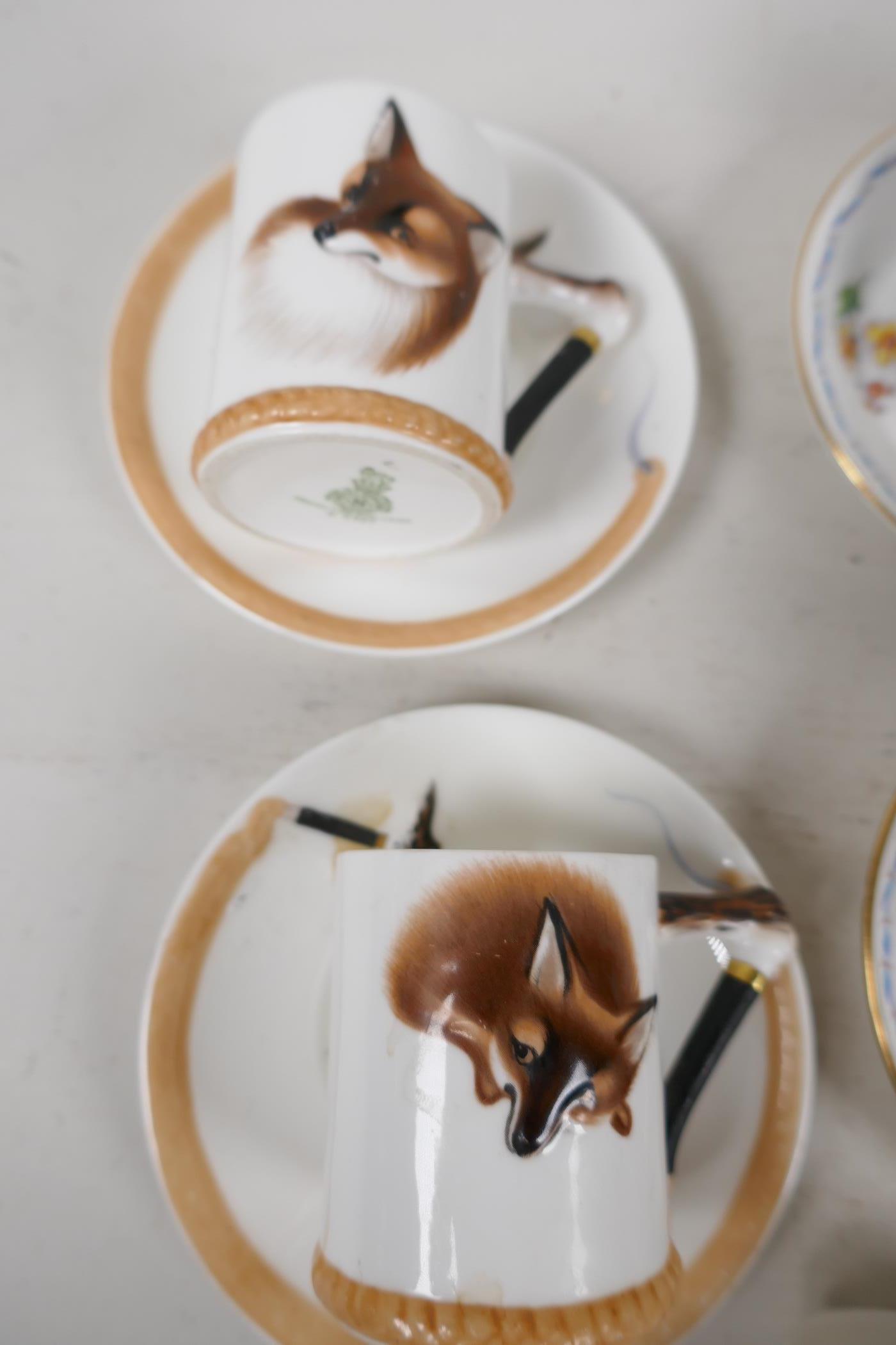 Four Royal Doulton coffee cans embossed and painted with fox heads, and two saucers, together with - Image 3 of 5