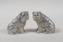 A pair of silver plated condiments in the form of bulldogs, marked 800 to base, 2½" high