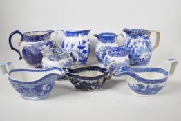 Six blue and white transfer printed jugs and three gravy boats, various patterns, largest 6" high