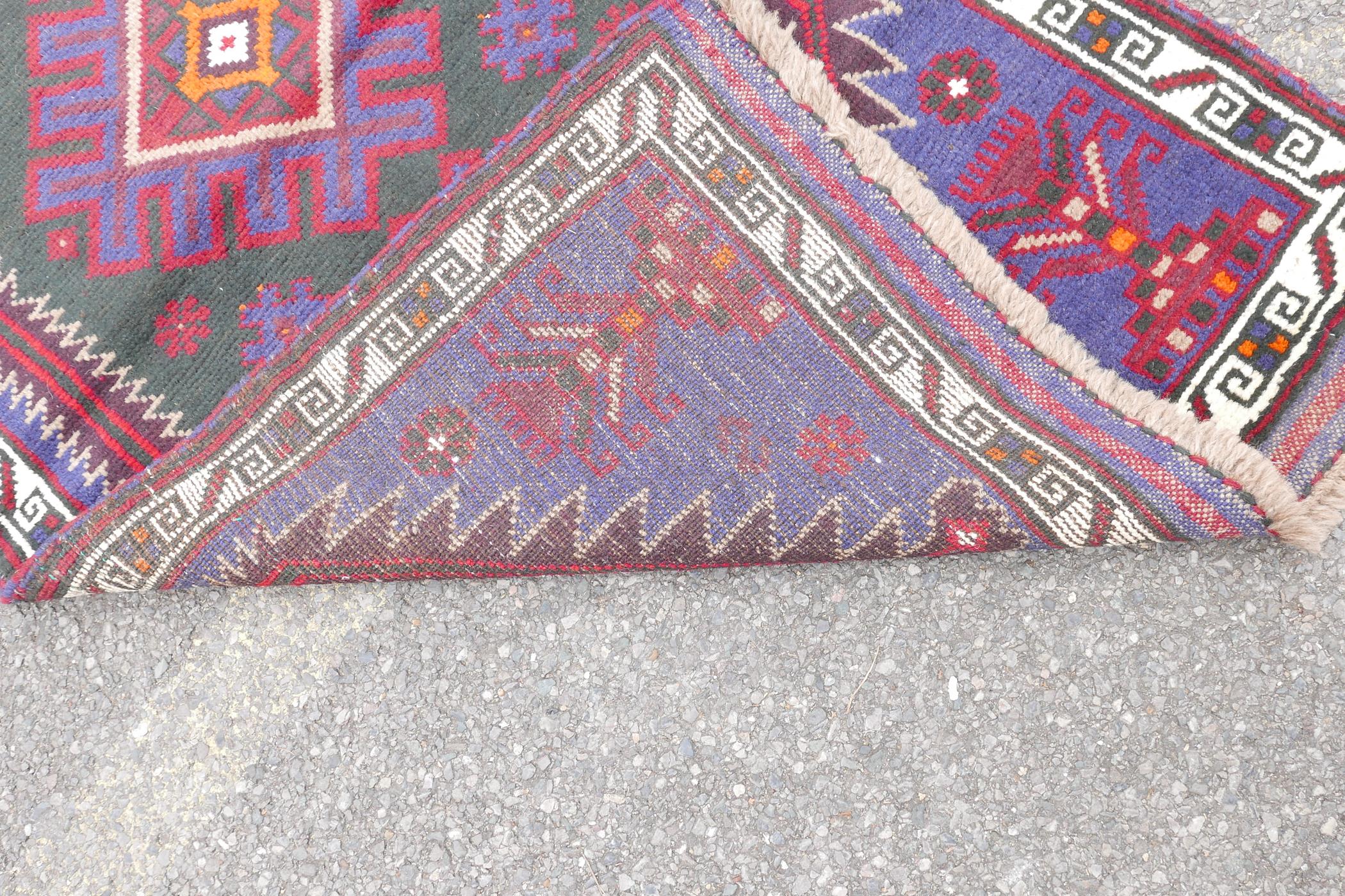 A multi colour ground full pile Belouch nomadic rug with unique medallion design, 36" x 60" - Image 4 of 4