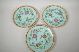Three continental porcelain plates decorated in the Oriental manner, 9½" diameter
