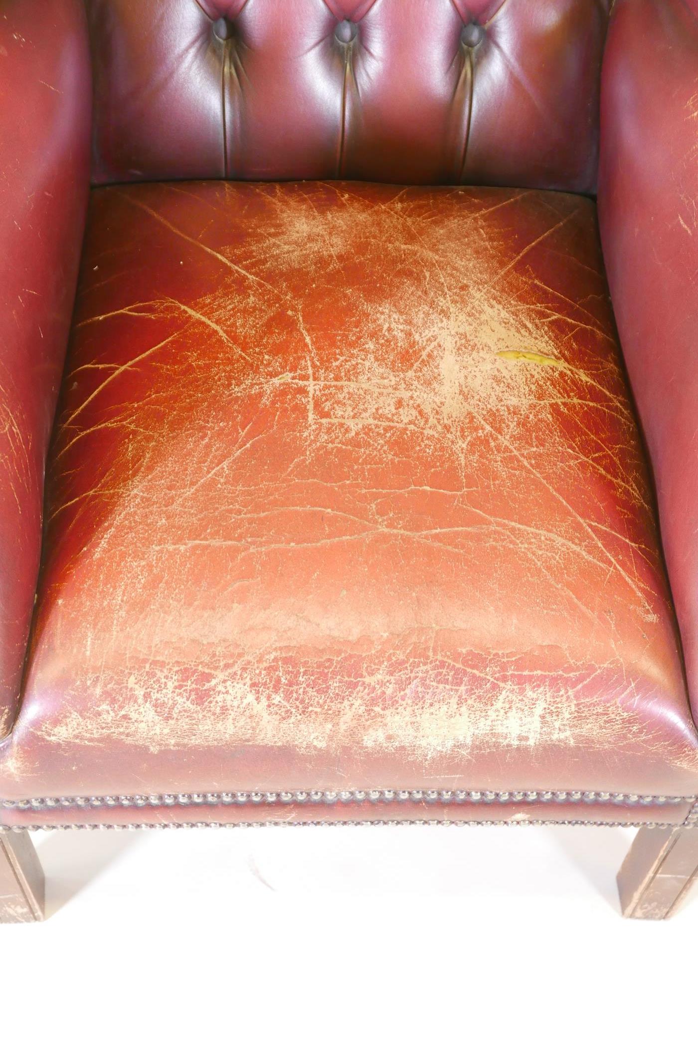 A C19th buttoned wing back armchair in red leather - Image 3 of 3