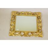 A Florentine style gilt wood wall mirror, 29" x 25"