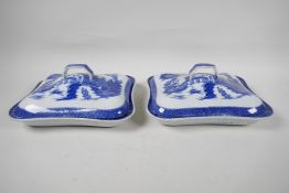 A pair of C19th Leeds Pottery blue and white tureens decorated with the Long Bridge Willow