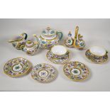 A collection of early C20th Italian Deruta pottery to include a teapot, oil and vinegar cruet, sugar