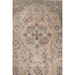 An oriental ivory ground silk carpet, with multicolour floral decoration within a black border, 151"