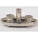 An early C19th Italian silver desk stand with gadrooned and pierced decoration on four ball and claw