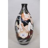 A Moorcroft trial vase with trapeze artist design, marked to base Trial, 20.3.14 with monogram, 12½"