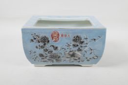 A Chinese blue crackle glazed porcelain planter, decorated with black and white flowers and pink
