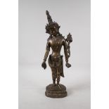 An Indian bronze deity on a lotus throne, 17" high