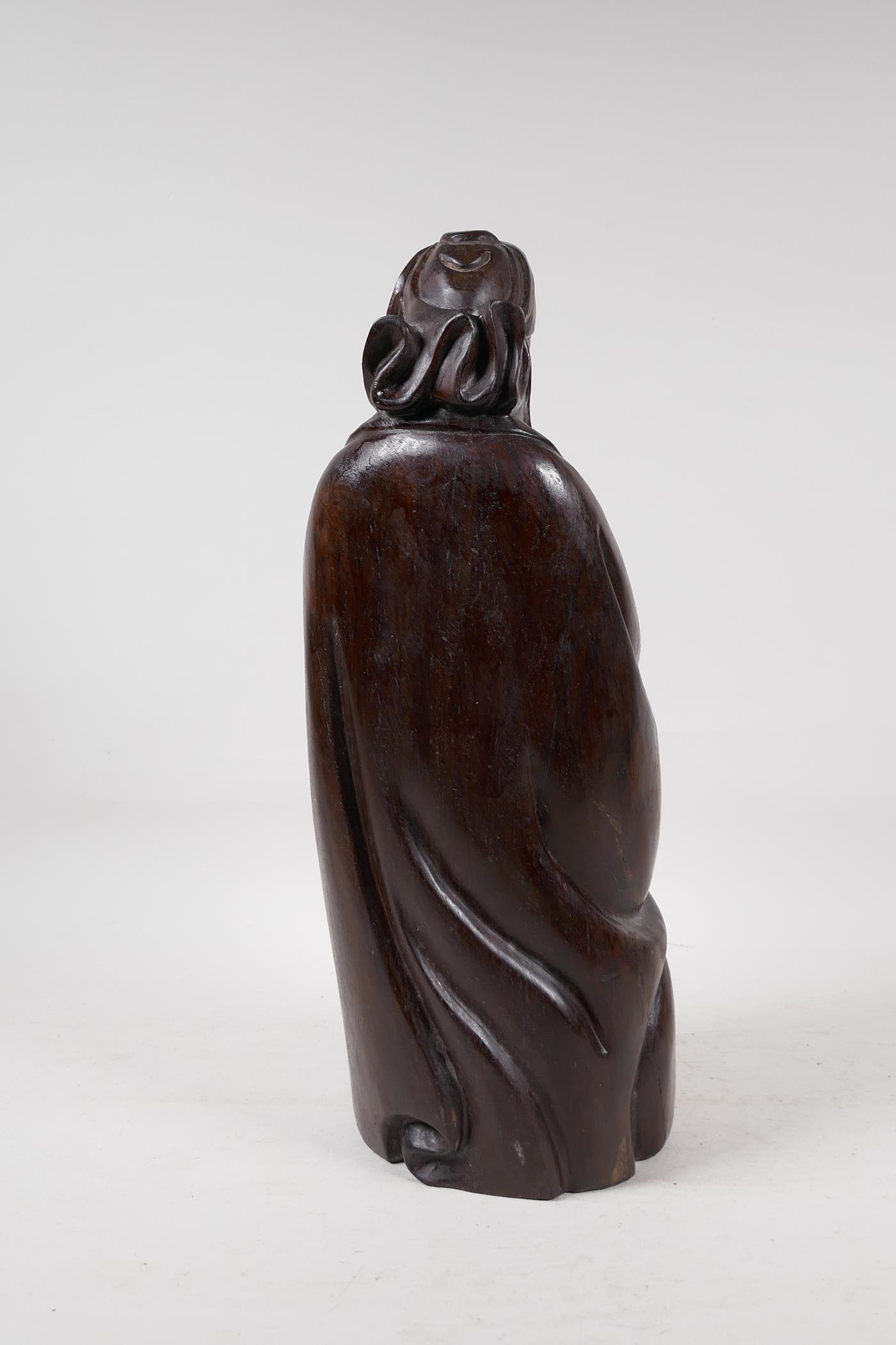 A Chinese carved hardwood figure of a sage carrying a child, 15" high - Image 4 of 5