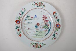 An C18th/C19th famille rose enamelled porcelain cabinet plate decorated with a riverside