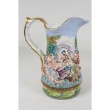 A Capodimonte style pottery jug embossed with Bacchanalian figures and painted in bright enamels,