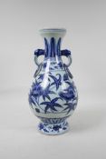 A blue and white porcelain vase with floral decoration, Chinese six character mark to side, 13½"