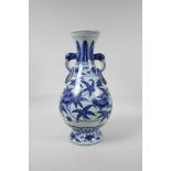 A blue and white porcelain vase with floral decoration, Chinese six character mark to side, 13½"