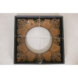 An antique giltwood and composition frame, housed in an ebony picture box frame, rebate 10" diameter