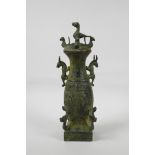 A Chinese archaic style bronze jar and cover, decorated with creatures of legend and character