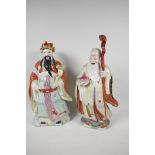 A Chinese porcelain figure of a dignitary with a bejewelled ruyi, painted in bright enamels, 15"