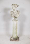 A concrete garden bust of a classical woman, on a fluted column plinth, 44" high