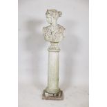 A concrete garden bust of a classical woman, on a fluted column plinth, 44" high