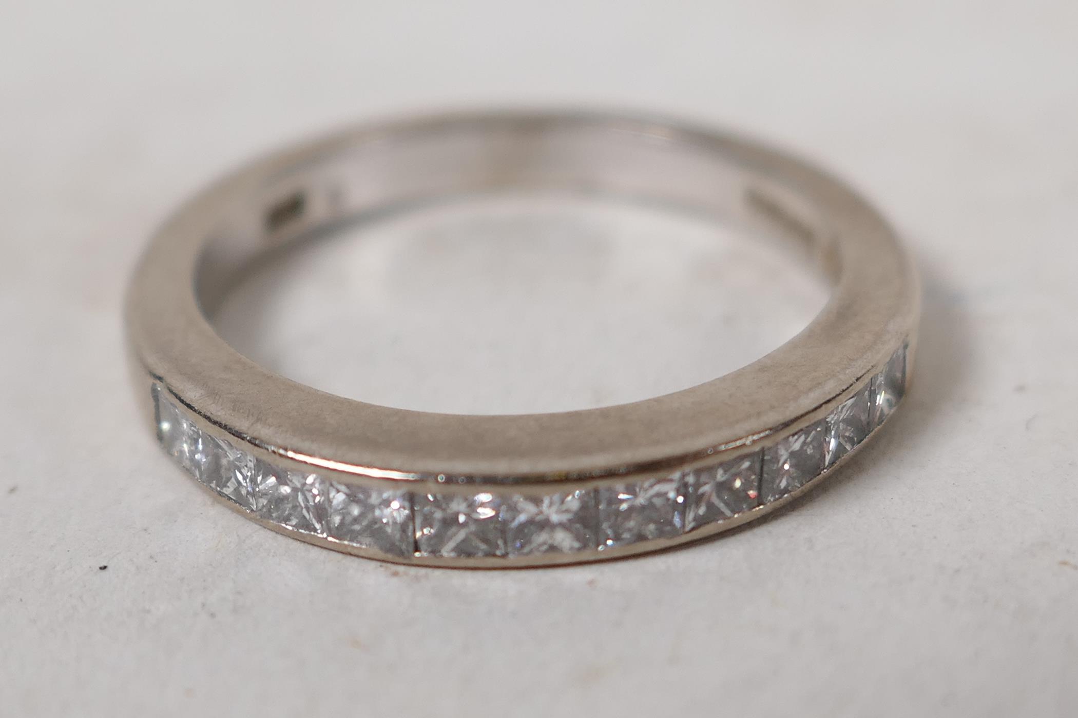 A hallmarked 18ct white gold half eternity ring, set with eleven princess cut diamonds, .5ct - Image 2 of 5