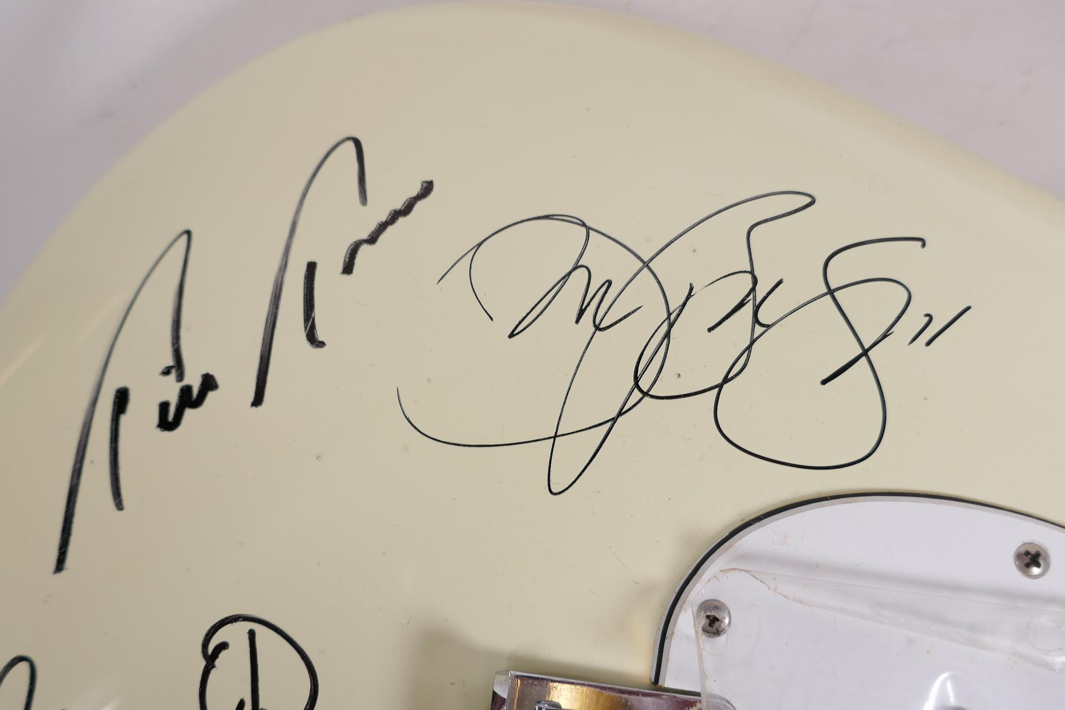 An unused Fender Stratocaster guitar bearing signatures from the band Bon Jovi, 39" long - Image 5 of 6