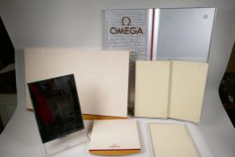 Two large Omega shop display stands, largest 24" x 22", a vintage Omega watches mirrored shop