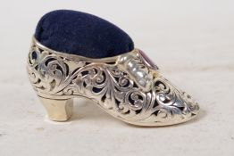 A sterling silver pin cushion in the form of a shoe, 2" long