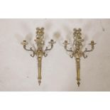 A pair of Empire style brass three branch wall sconces