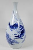 An oriental blue and white porcelain vase painted with fish, 15" high