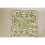 A Florentine style silver composition wall mirror, 31" x 31"