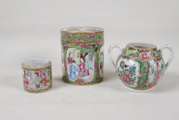 A canton famille rose porcelain cylinder jar and cover decorated with figures in a court, and