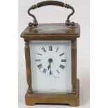 A French brass cased carriage clock made for Mappin & Webb Ltd, with white enamel dial and Roman