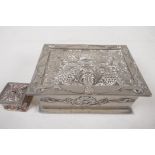A silver plated trinket box with chased and applied decoration of flowers, 5" x 4" x 2", and an
