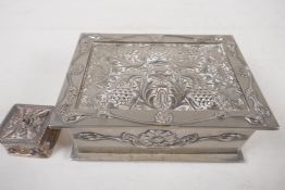 A silver plated trinket box with chased and applied decoration of flowers, 5" x 4" x 2", and an