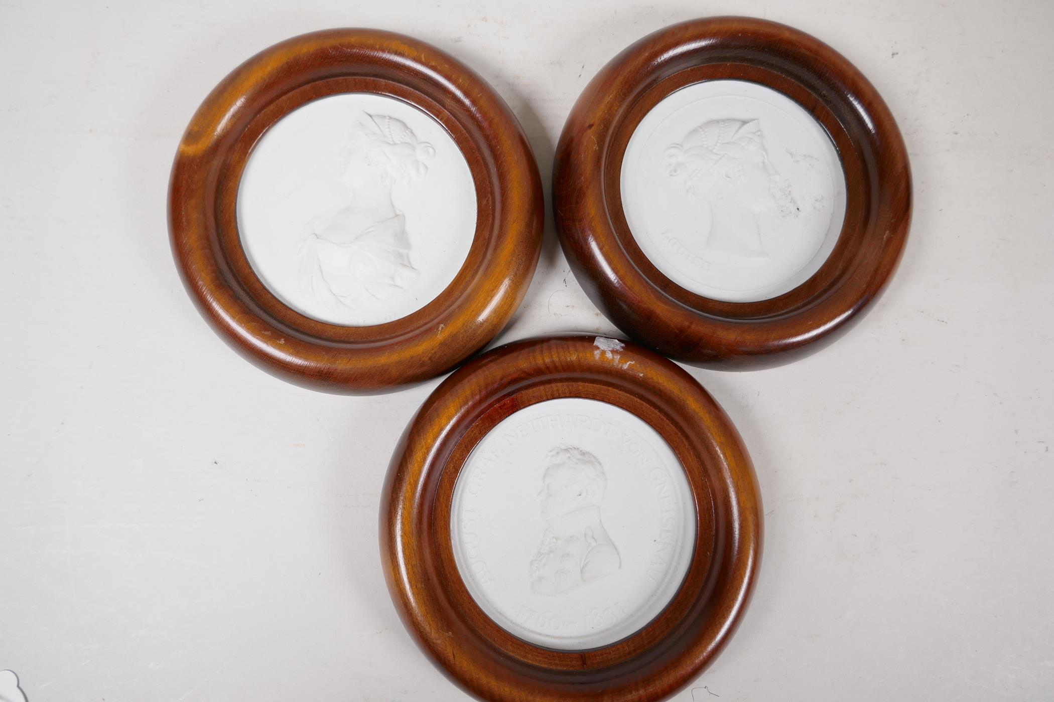 Three Meissen parian portrait plaques of C19th German dignitaries, 4" diameter, framed