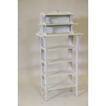 A painted pine seven tier open shelf, 20½" x 9", 40" high