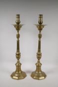 A pair of C19th turned brass candlesticks, 25" high