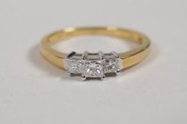 A 18ct yellow gold three stone diamond ring, size M