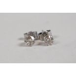 A pair of 14ct white gold diamond stud earrings, approx 0.5ct