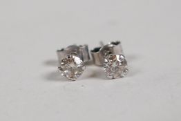 A pair of 14ct white gold diamond stud earrings, approx 0.5ct