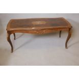 A Rococo style walnut and mahogany veneered coffee table on cabriole supports with ormolu mounts,