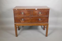 A mahogany three drawer chest of drawers on an adapted stand, 32" high, 37" wide, 18" deep