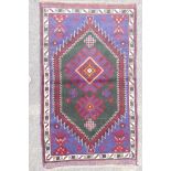 A multi colour ground full pile Belouch nomadic rug with unique medallion design, 36" x 60"
