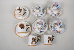 Four Royal Doulton coffee cans embossed and painted with fox heads, and two saucers, together with