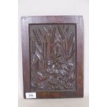 An antique mahogany panel, well carved with a serpent, bird and butterfly under reeds, 12" x 9"