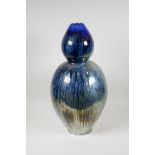 A vintage French blue lustre glazed terracotta double goured vase, stamped and indistinctly signed