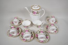 A Royal Worcester 'Royal Garden' pattern six place coffee service with coffee pot, cream jug and