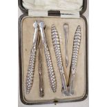 A boxed set of C19th silver plated shellfish tools and crackers, 5½" long